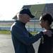 Saline cross country head coach Mike Smith congratulates junior Gloria Park on how well she finished the race on Saturday. Daniel Brenner I AnnArbor.com
